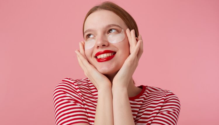 Nice young red-haired lady with red lips, in a red striped T-shi